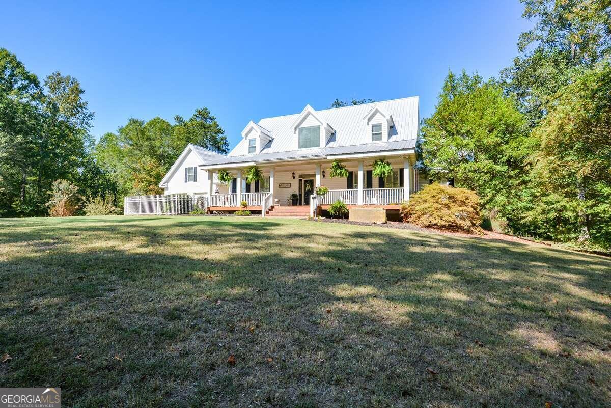 a view of a house with a big yard