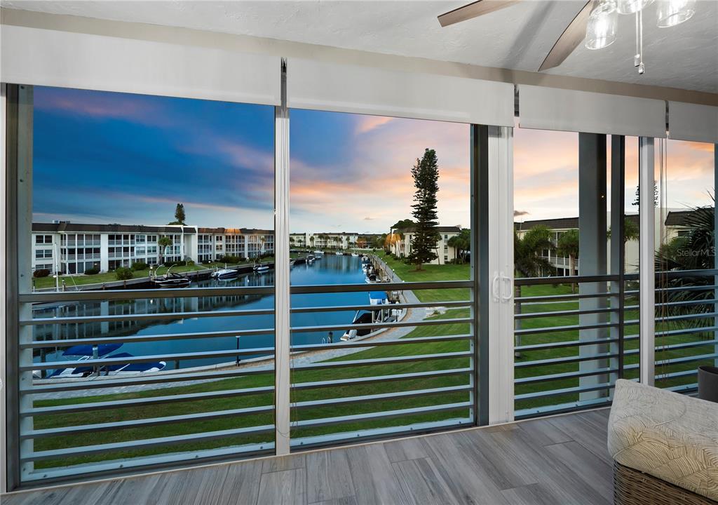 a view of a balcony and floor to ceiling window