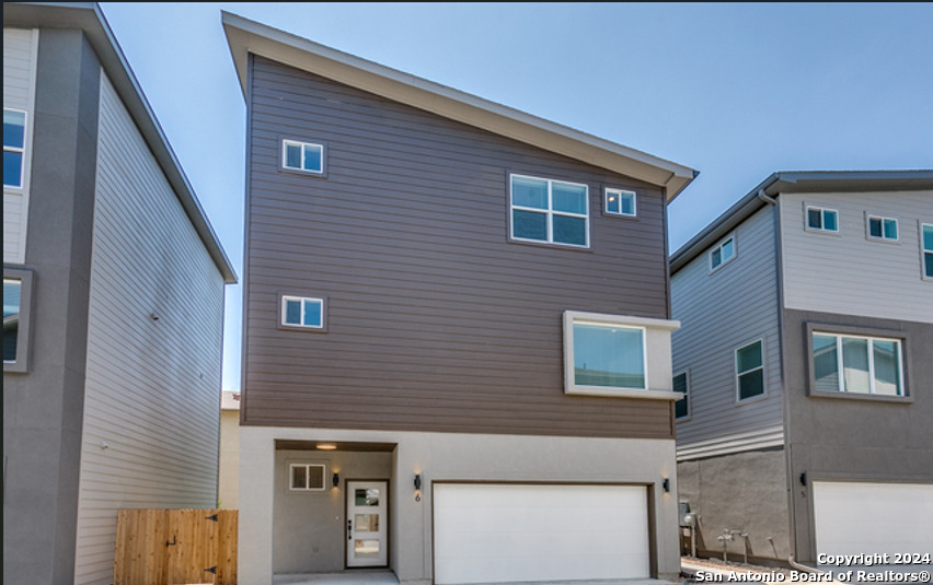 a front view of a house with parking