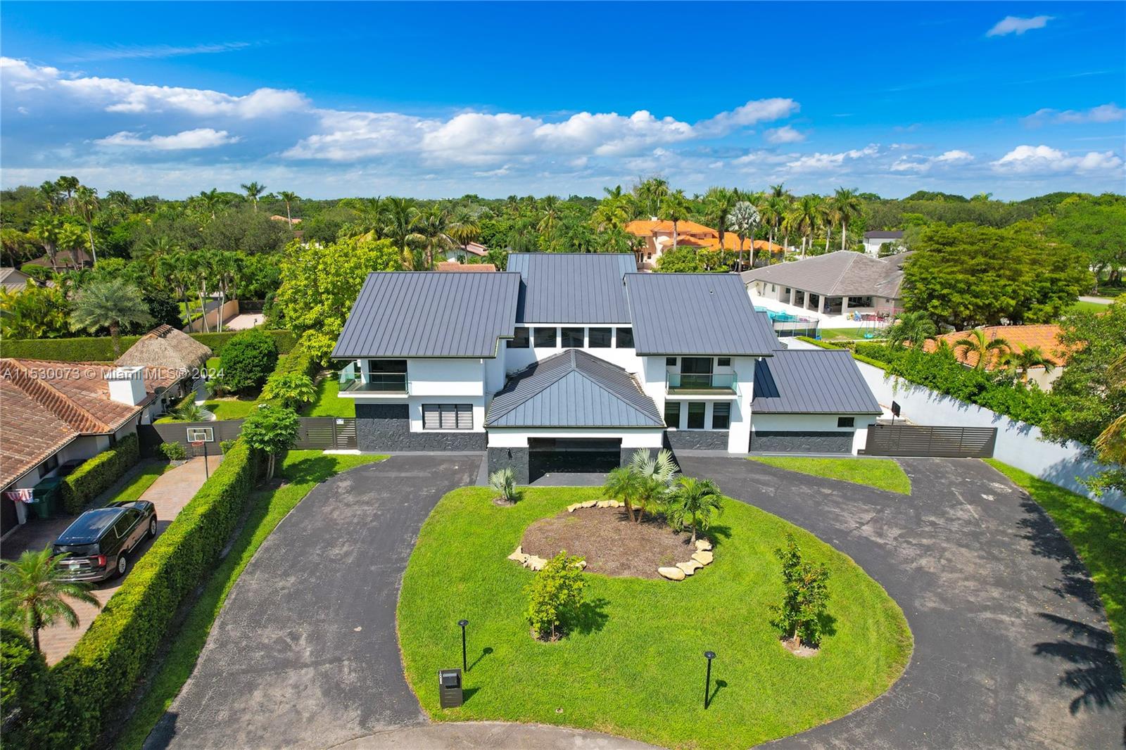 an aerial view of a house with swimming pool garden and mountain view