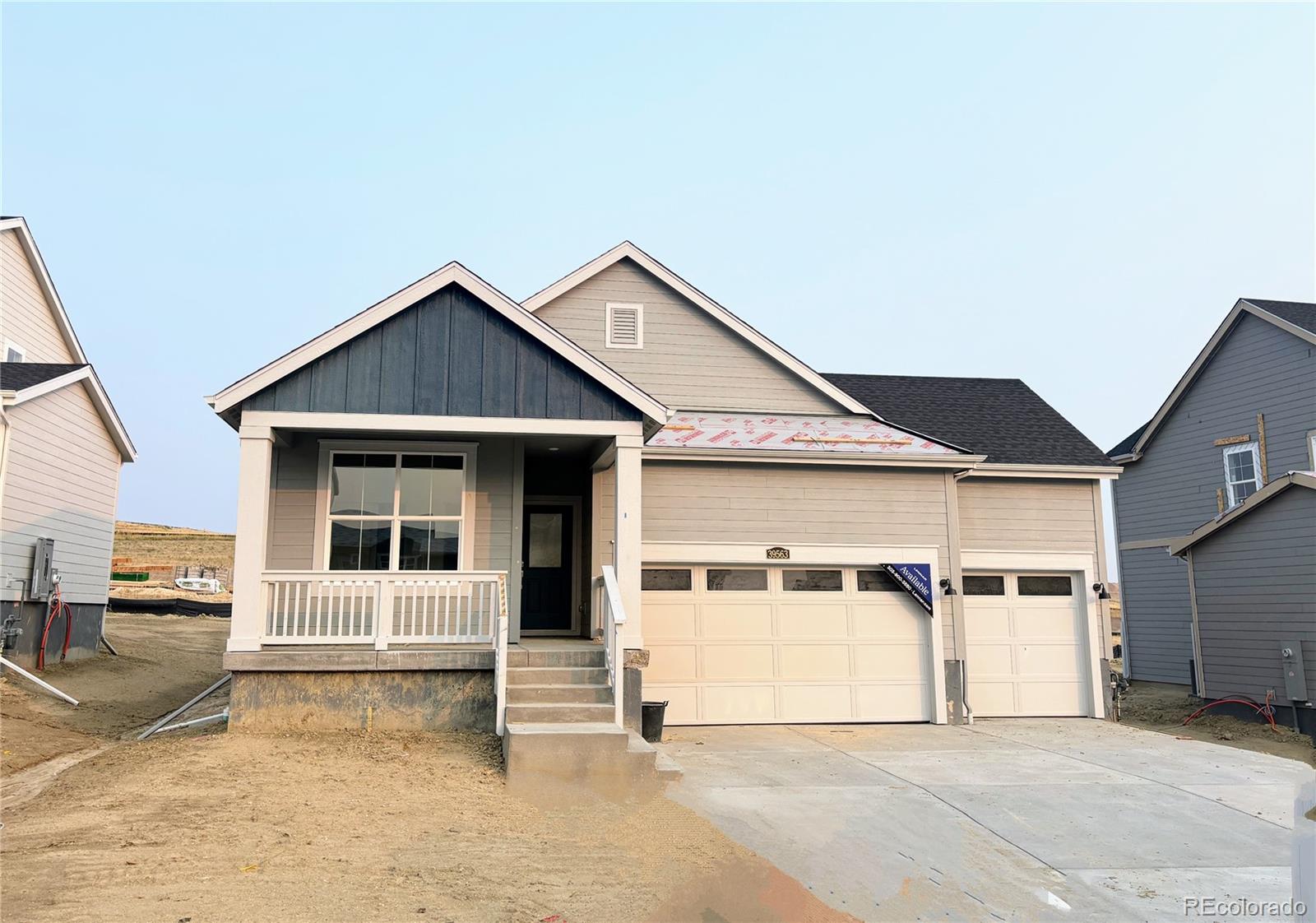 a front view of a house with a garage