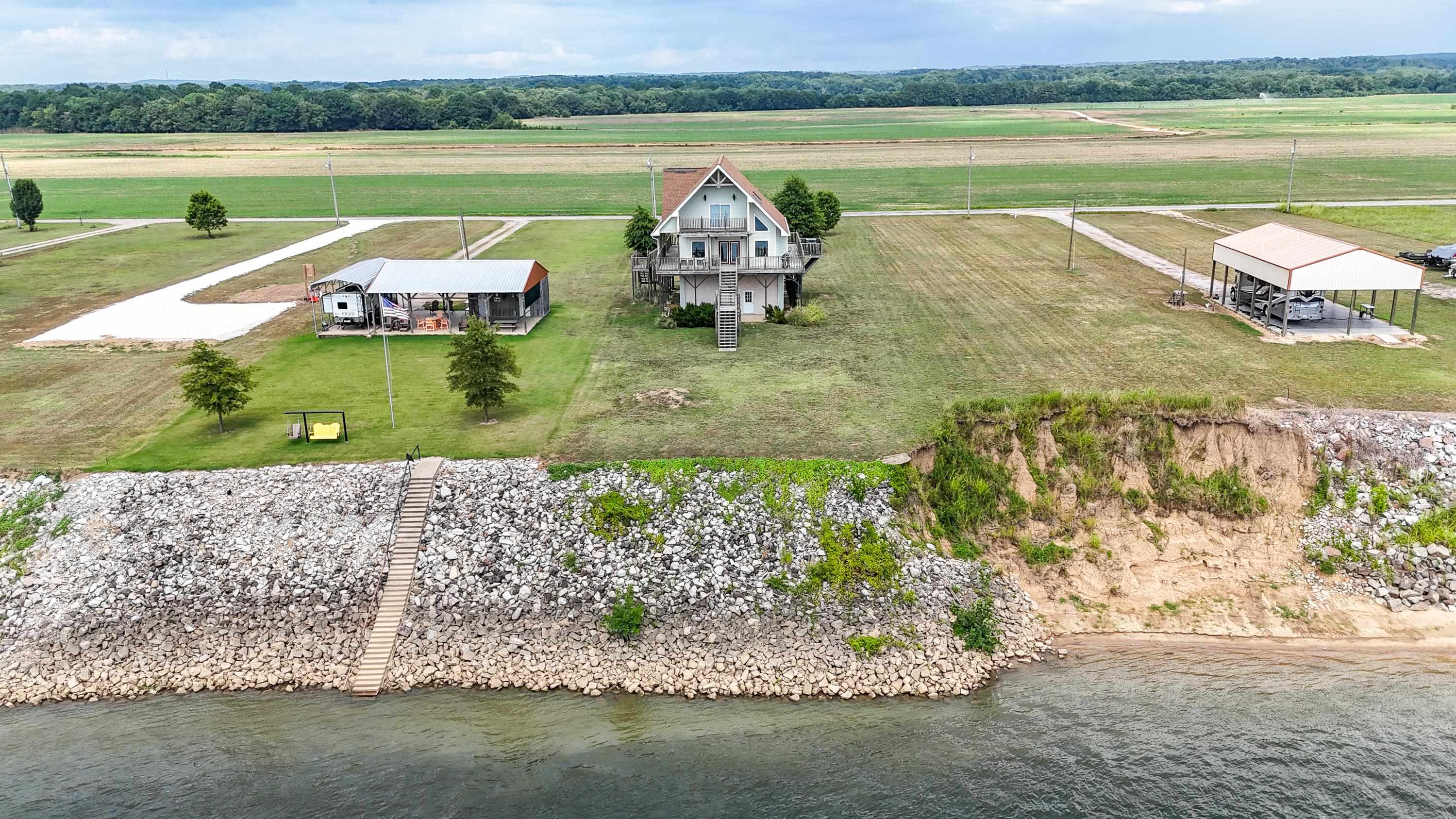 Drone / aerial view featuring a water view and a rural view