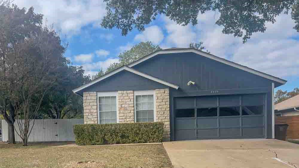 front view of a house with a yard