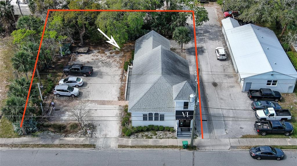 an aerial view of residential houses with street