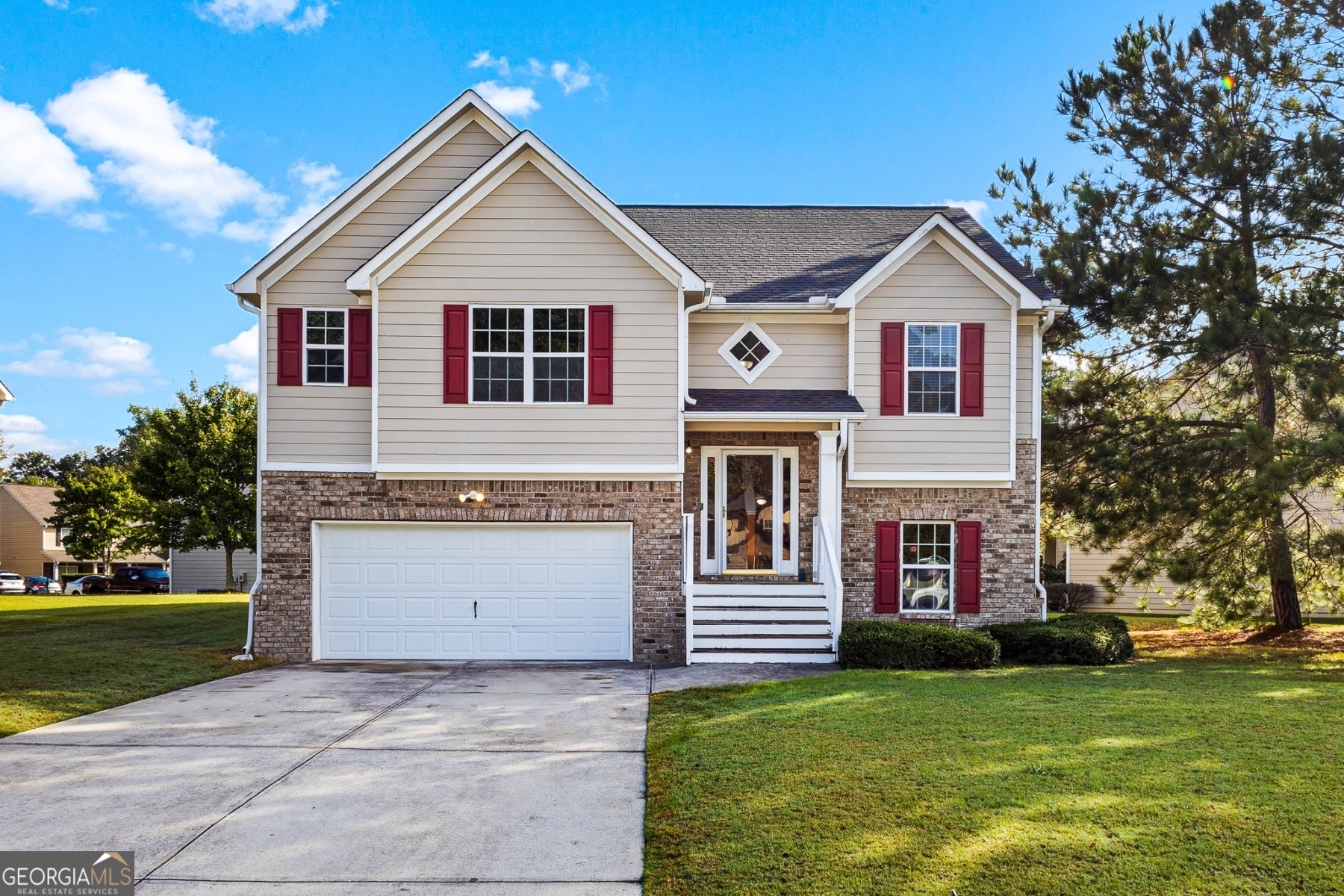 a front view of a house with a yard