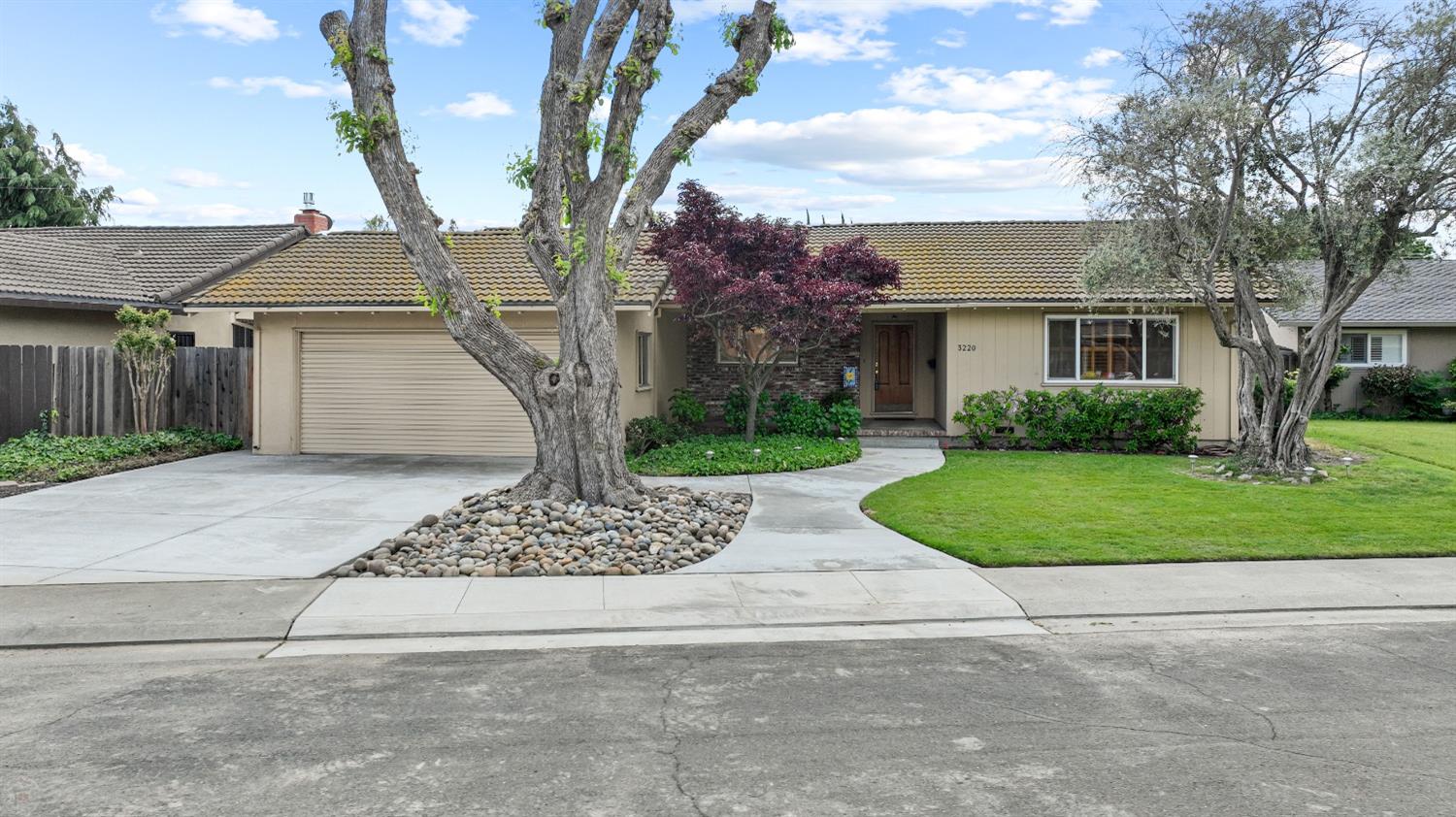 front view of a house with a yard