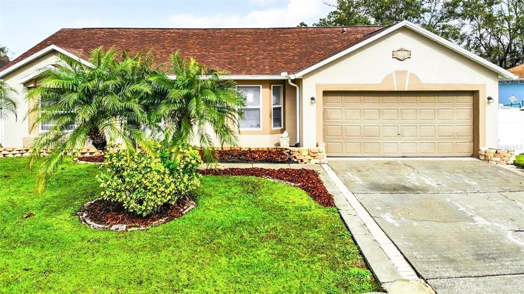 a view of a house with a yard