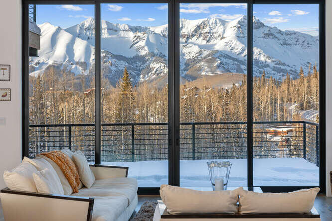 a view of sitting area with furniture and city view