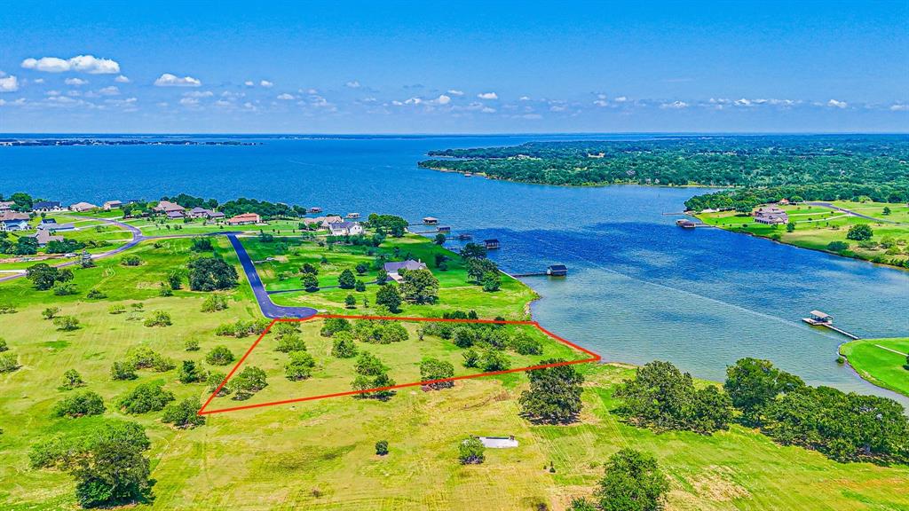 a view of a lake with a yard