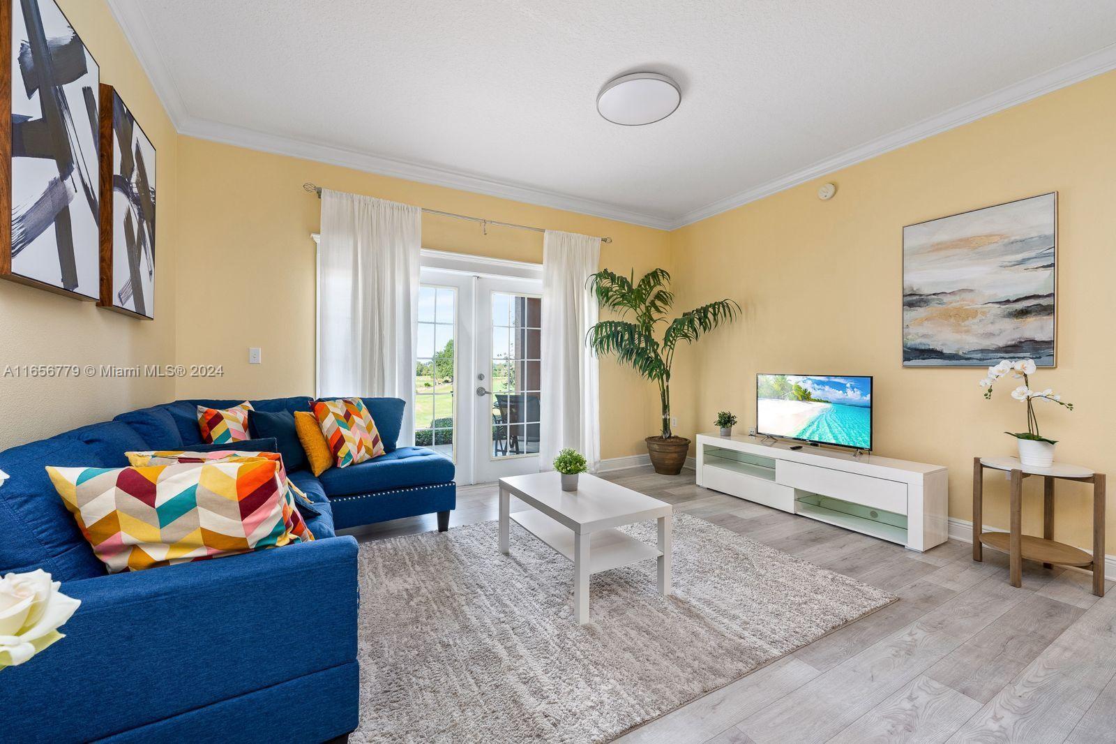 a living room with furniture and a couch