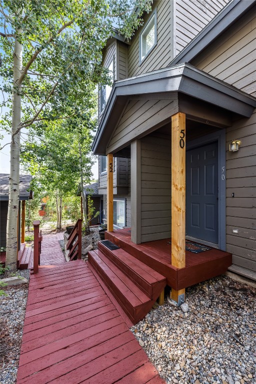 a view of house with wooden floor and outdoor seating