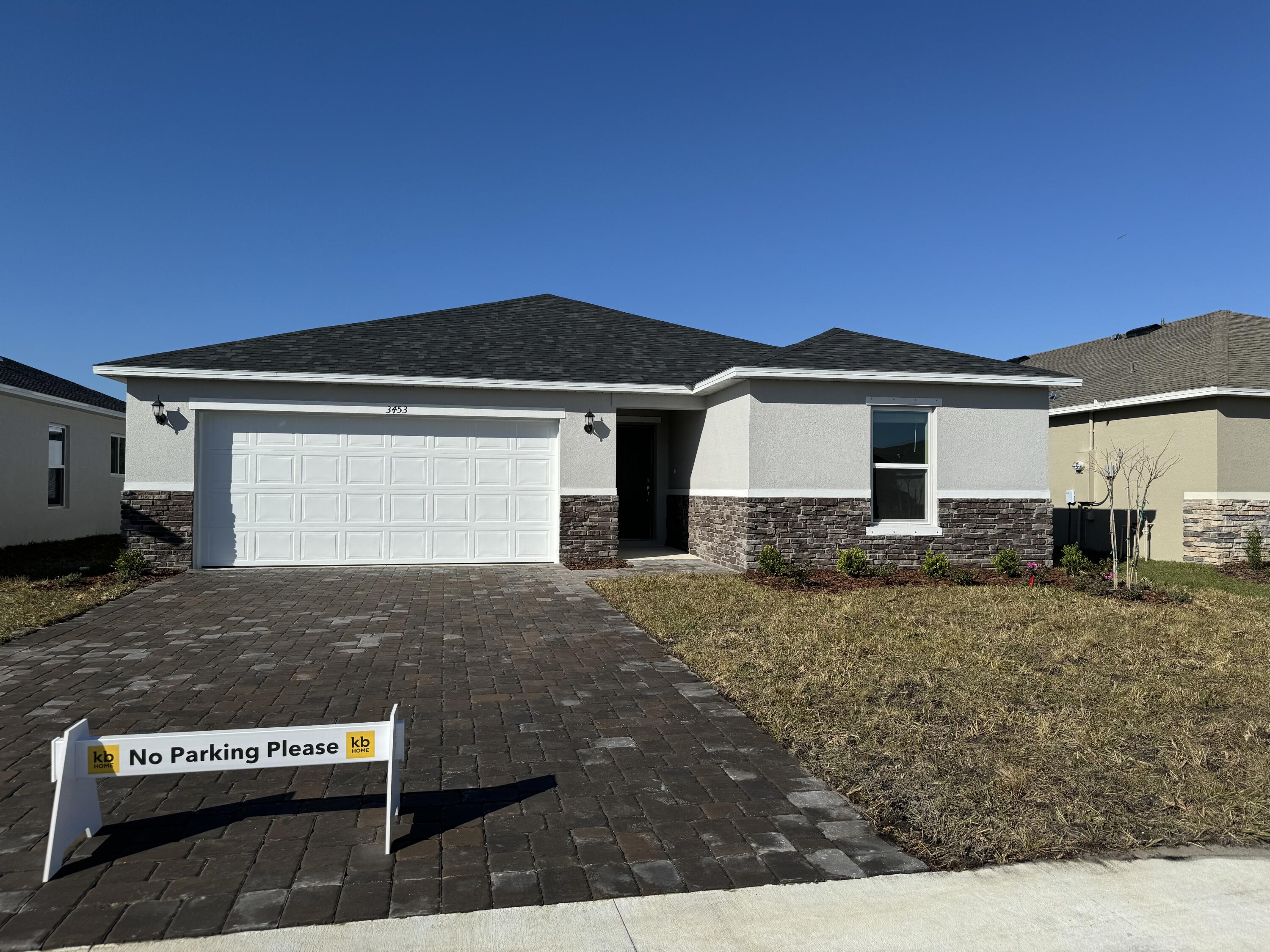 a front view of a house with yard