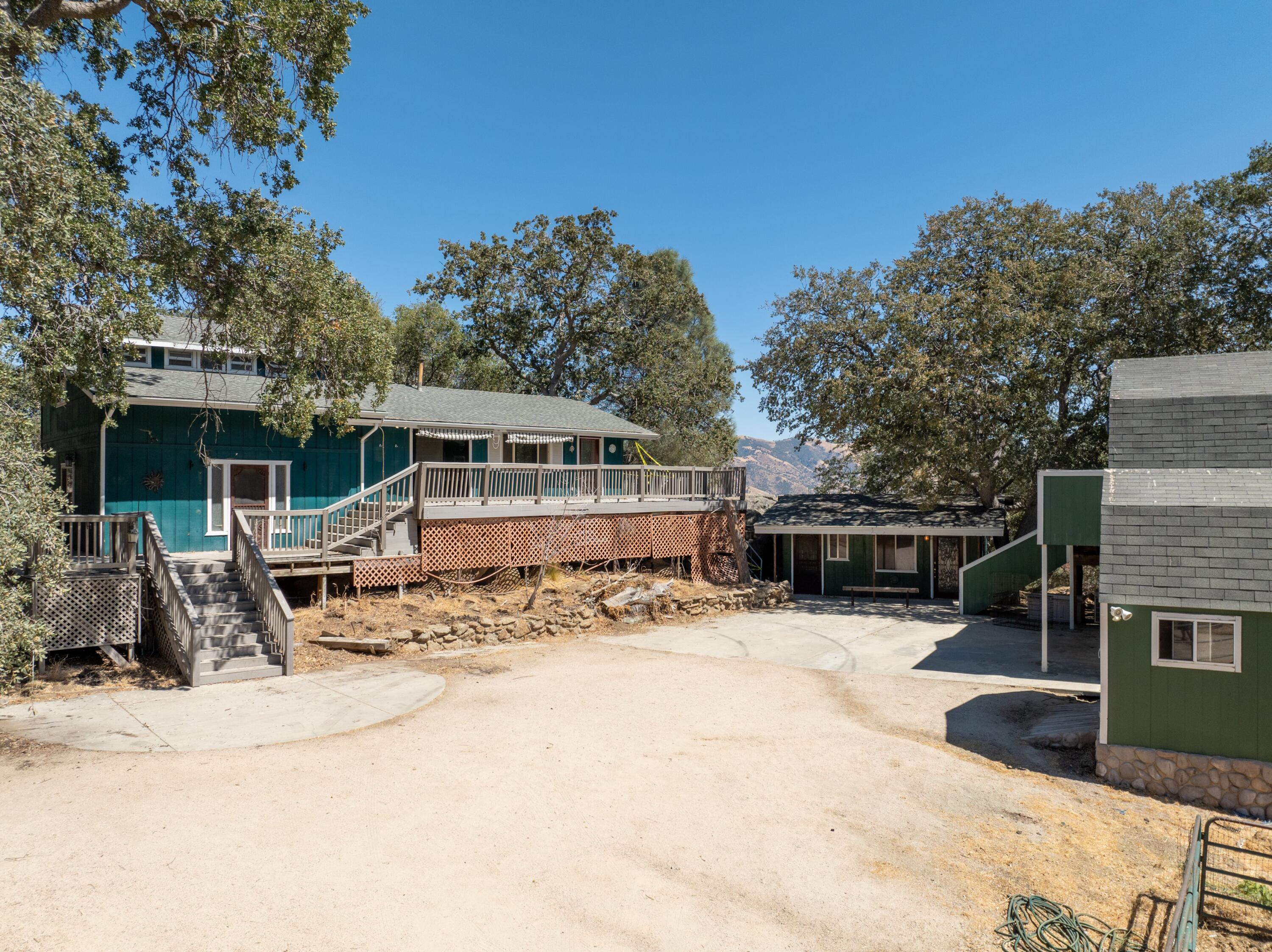 a view of house with yard outdoor seating and entertaining space