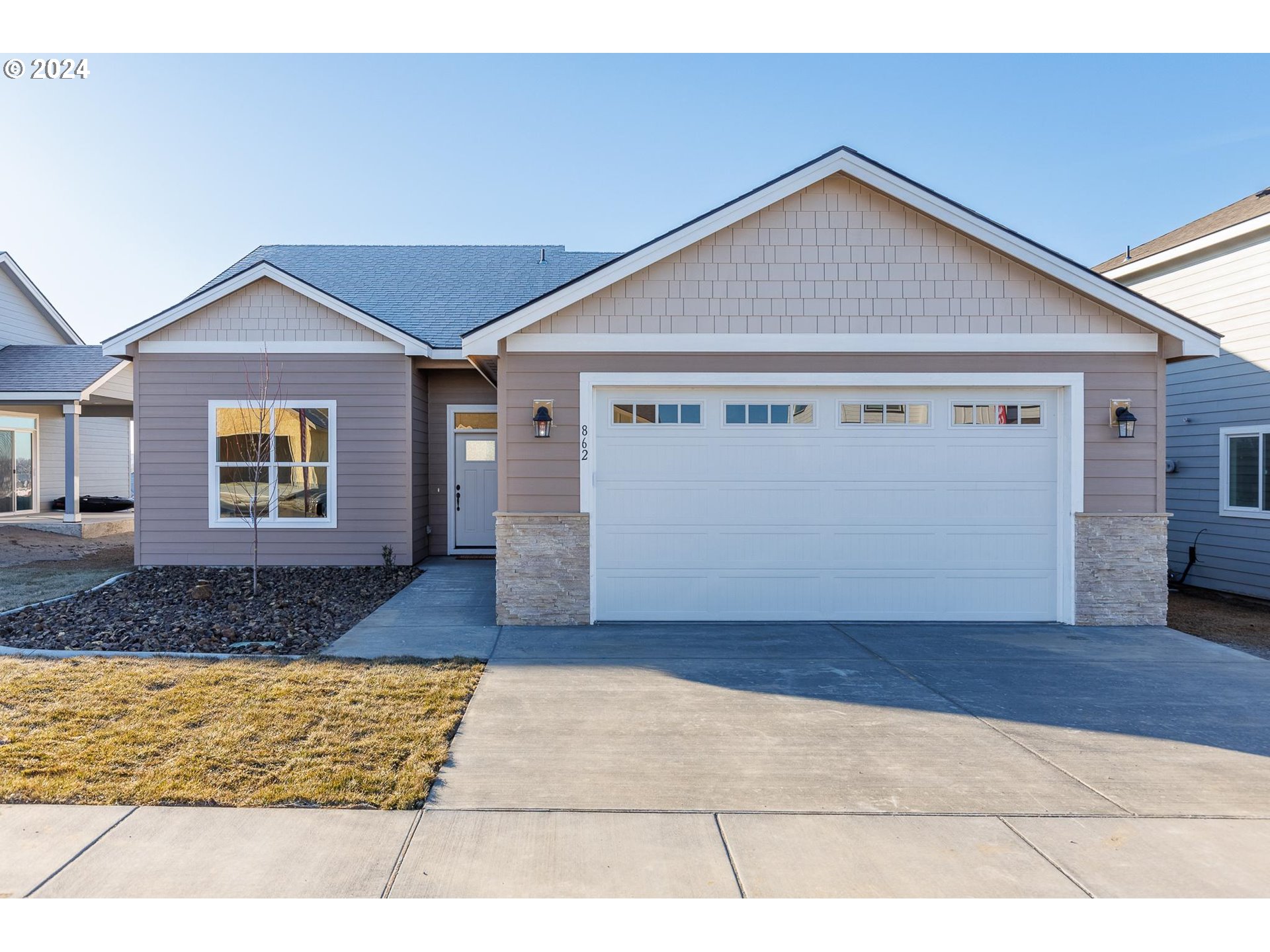 a front view of a house with a yard