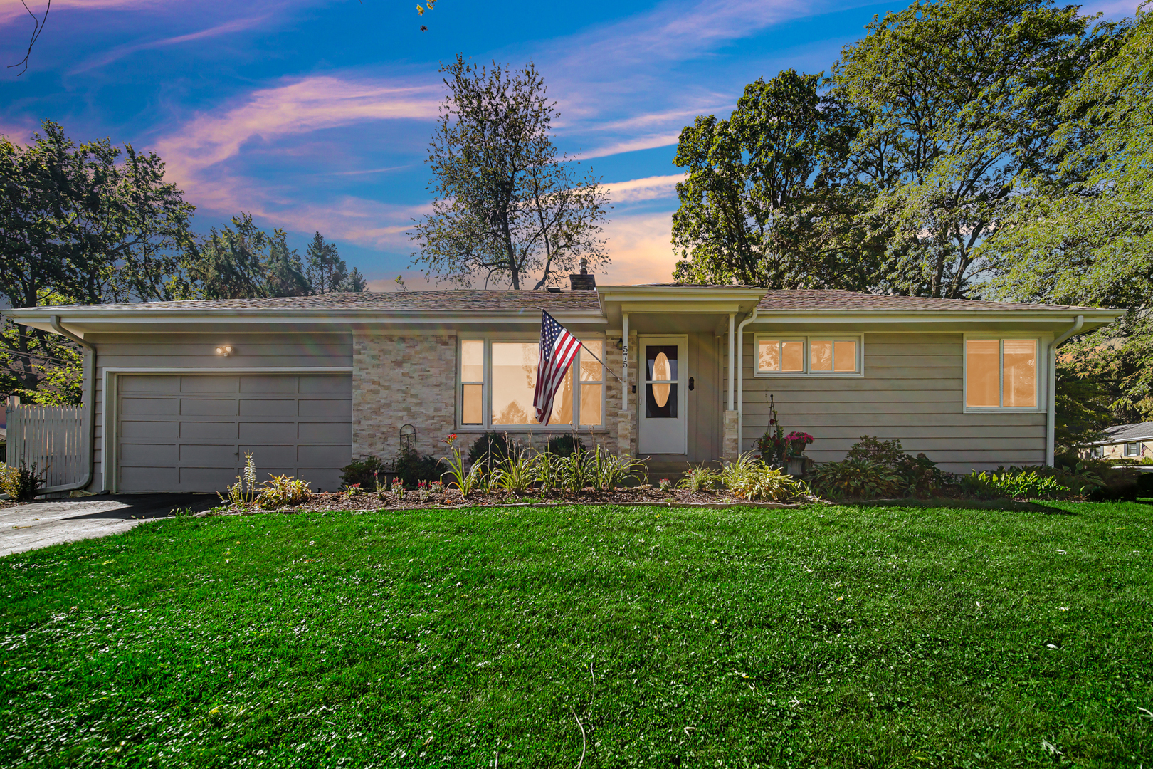 front view of a house with a yard