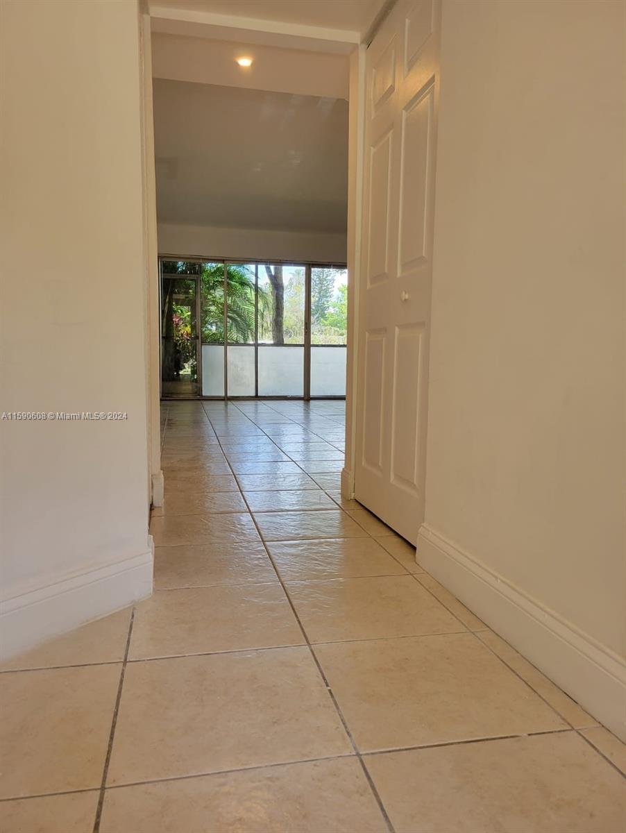 a view of hallway with a large window