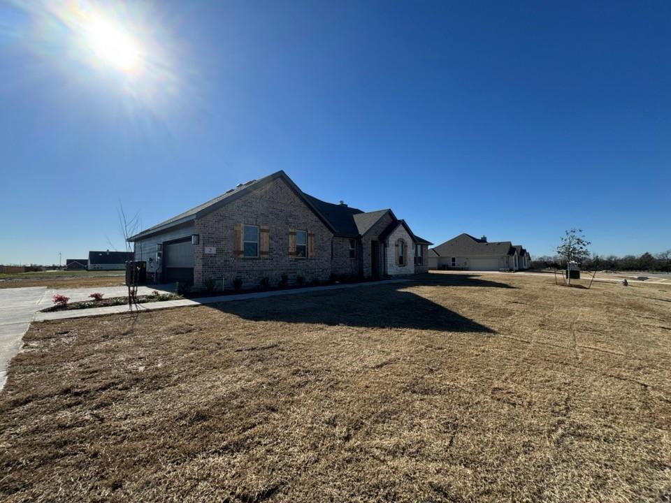 a view of large house with a yard