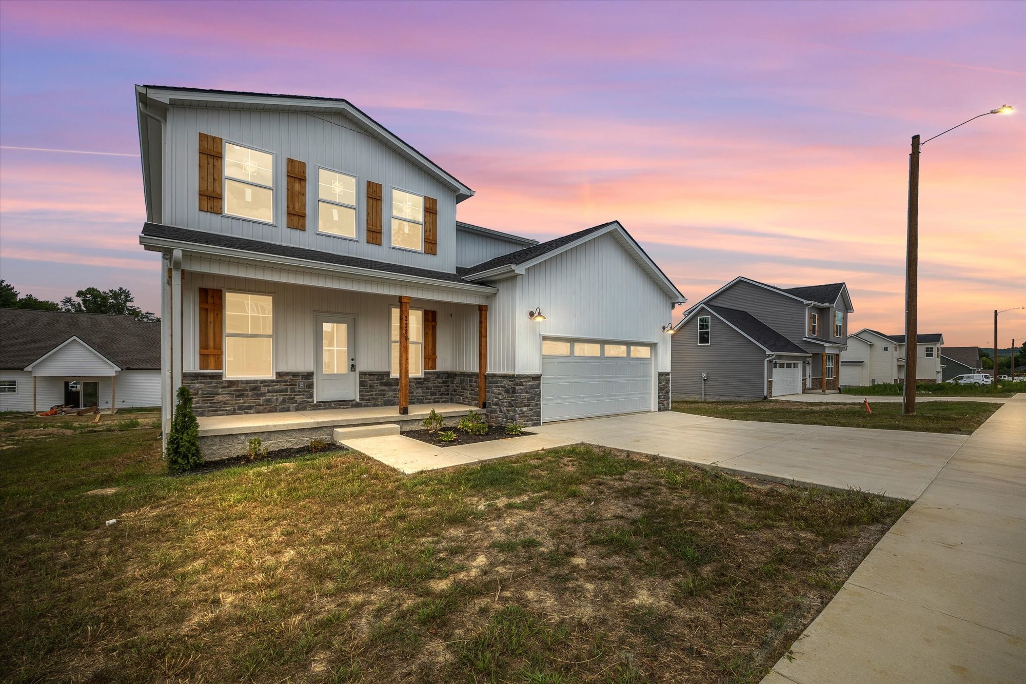 front view of a house with a yard