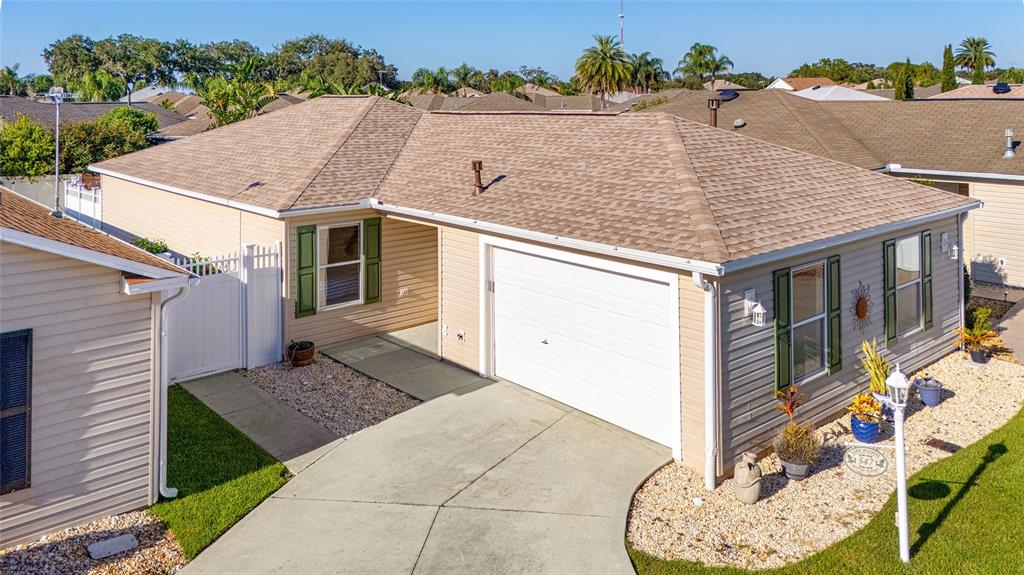 a aerial view of a house with a yard