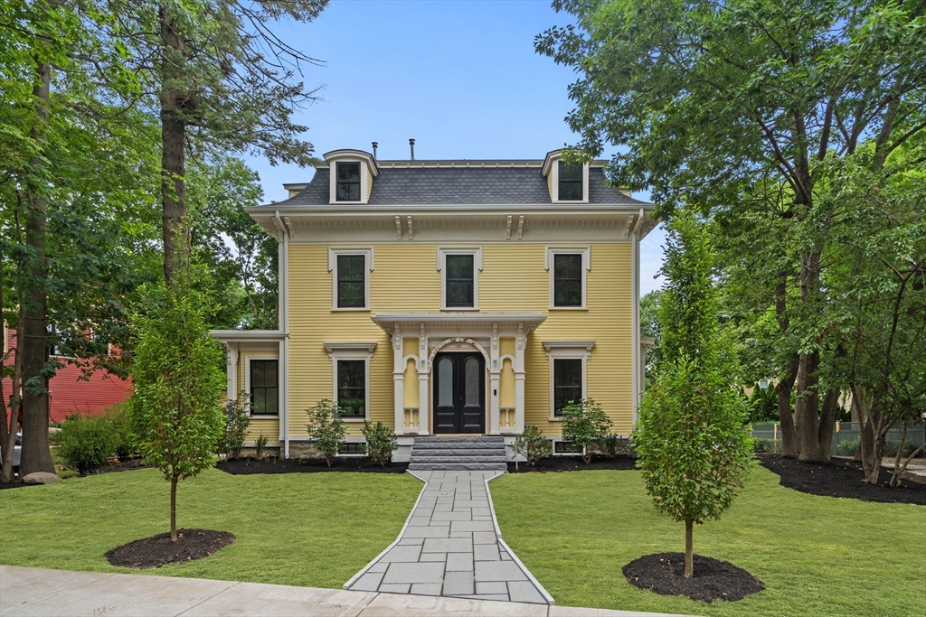 a front view of a house with a yard