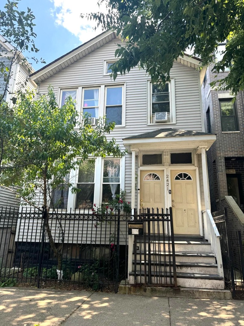 a front view of a house with a balcony