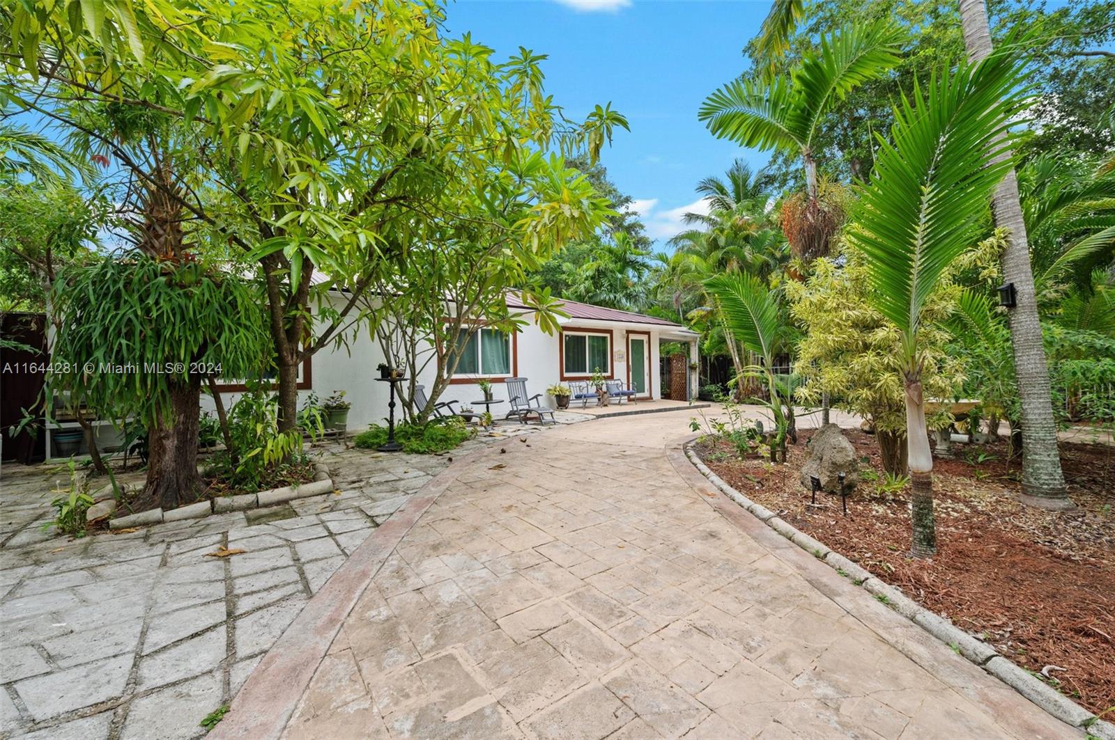 a house with trees in front of it