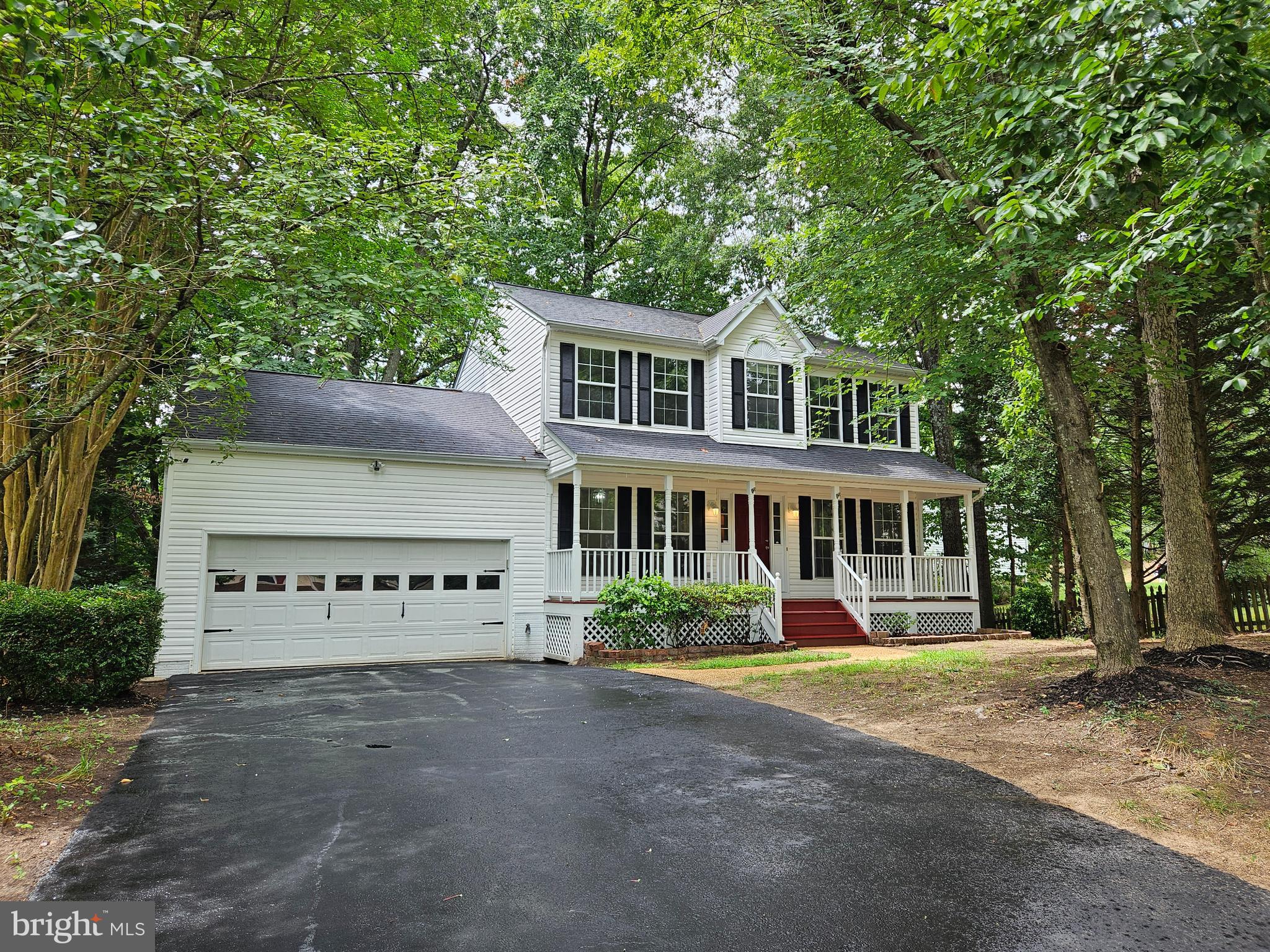 front view of a house with a garden