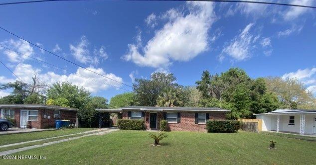 front view of a house with a yard