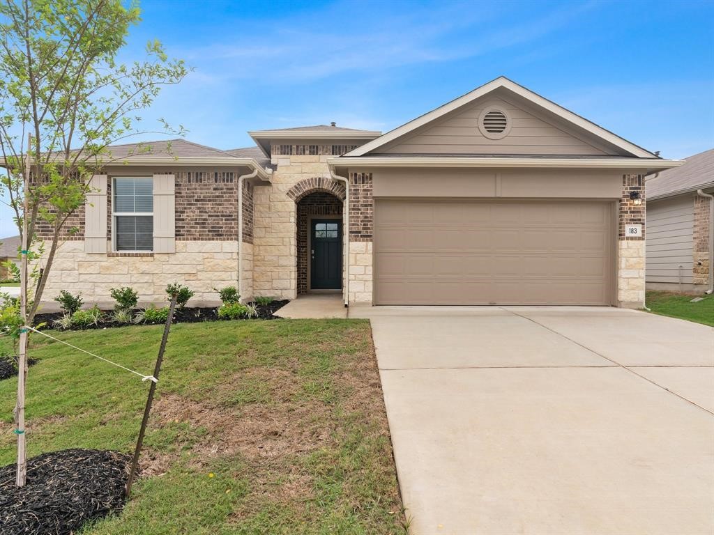 front view of a house with a yard