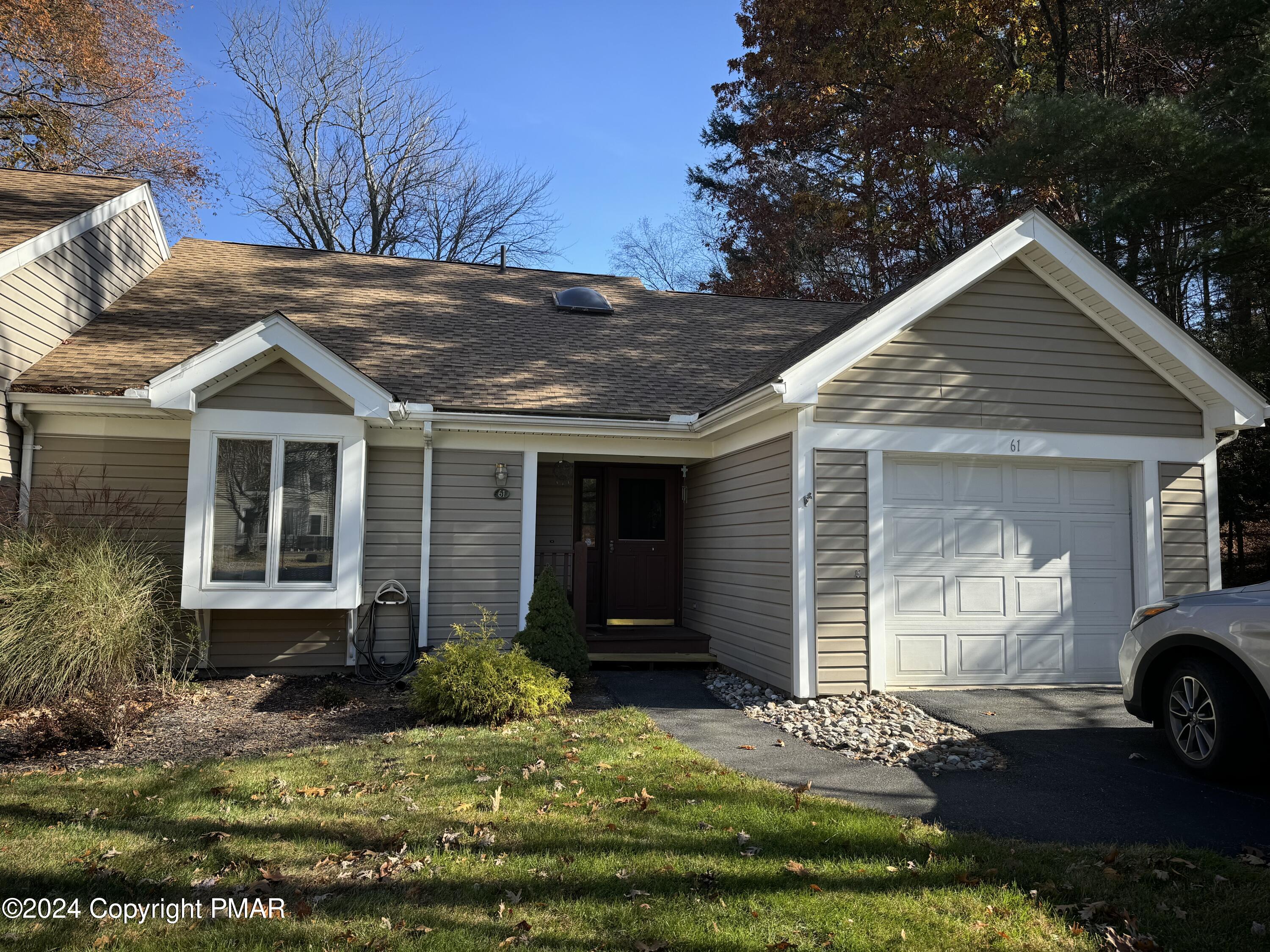 a front view of a house with a yard