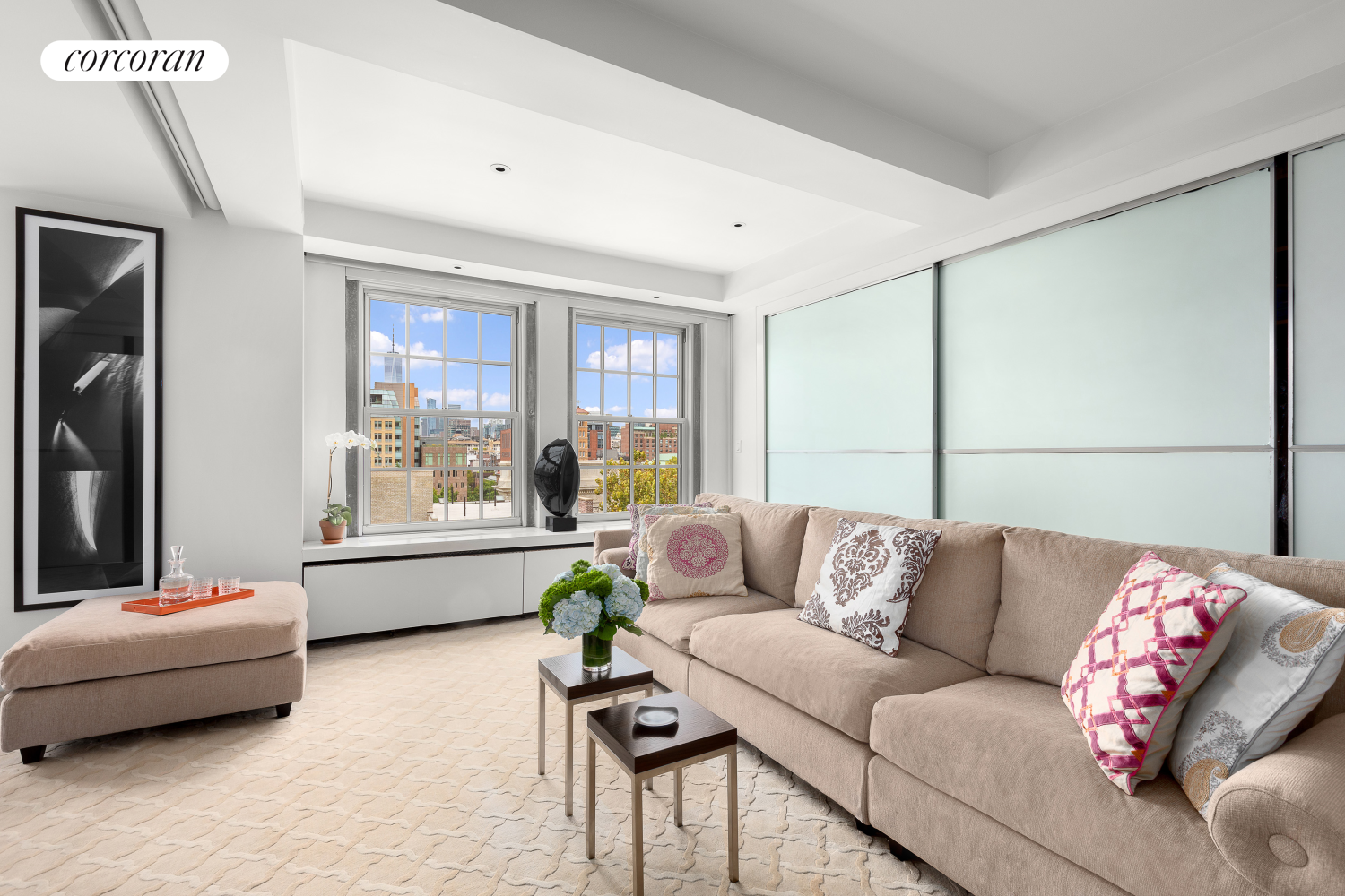 a living room with furniture and a large window