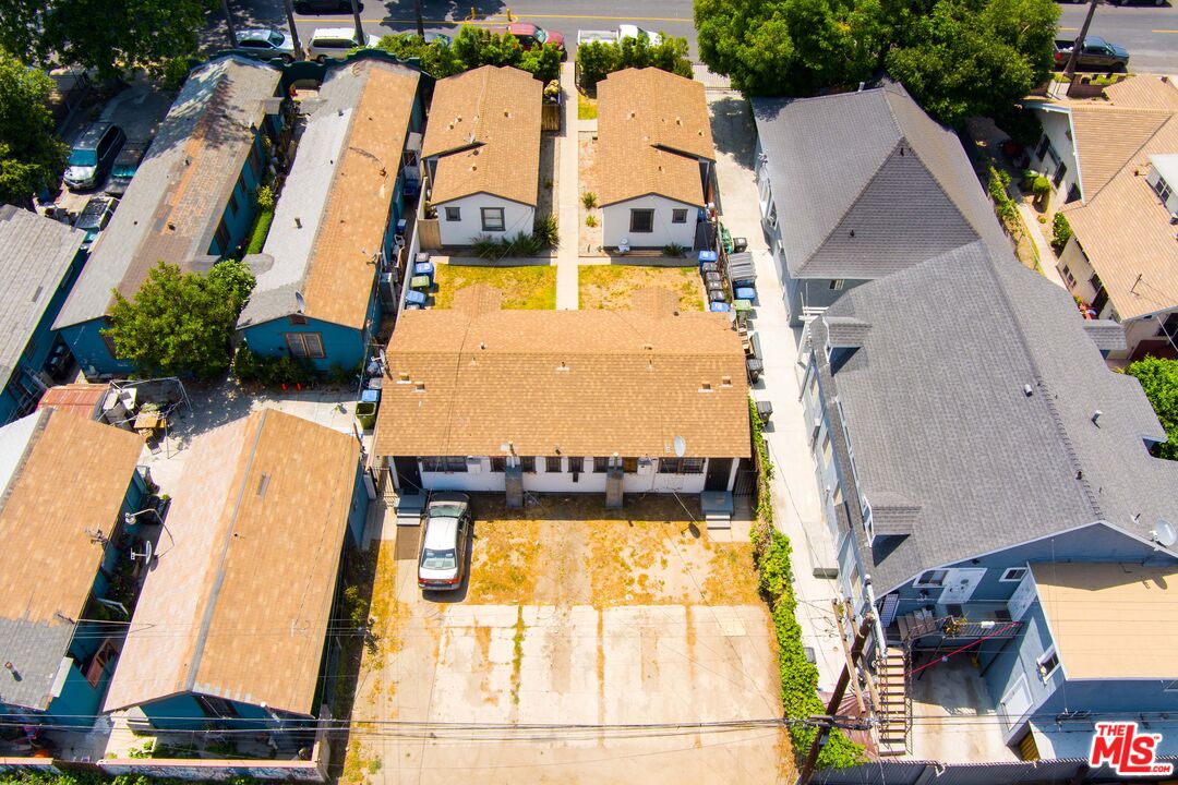 an aerial view of residential house with outdoor space and swimming pool