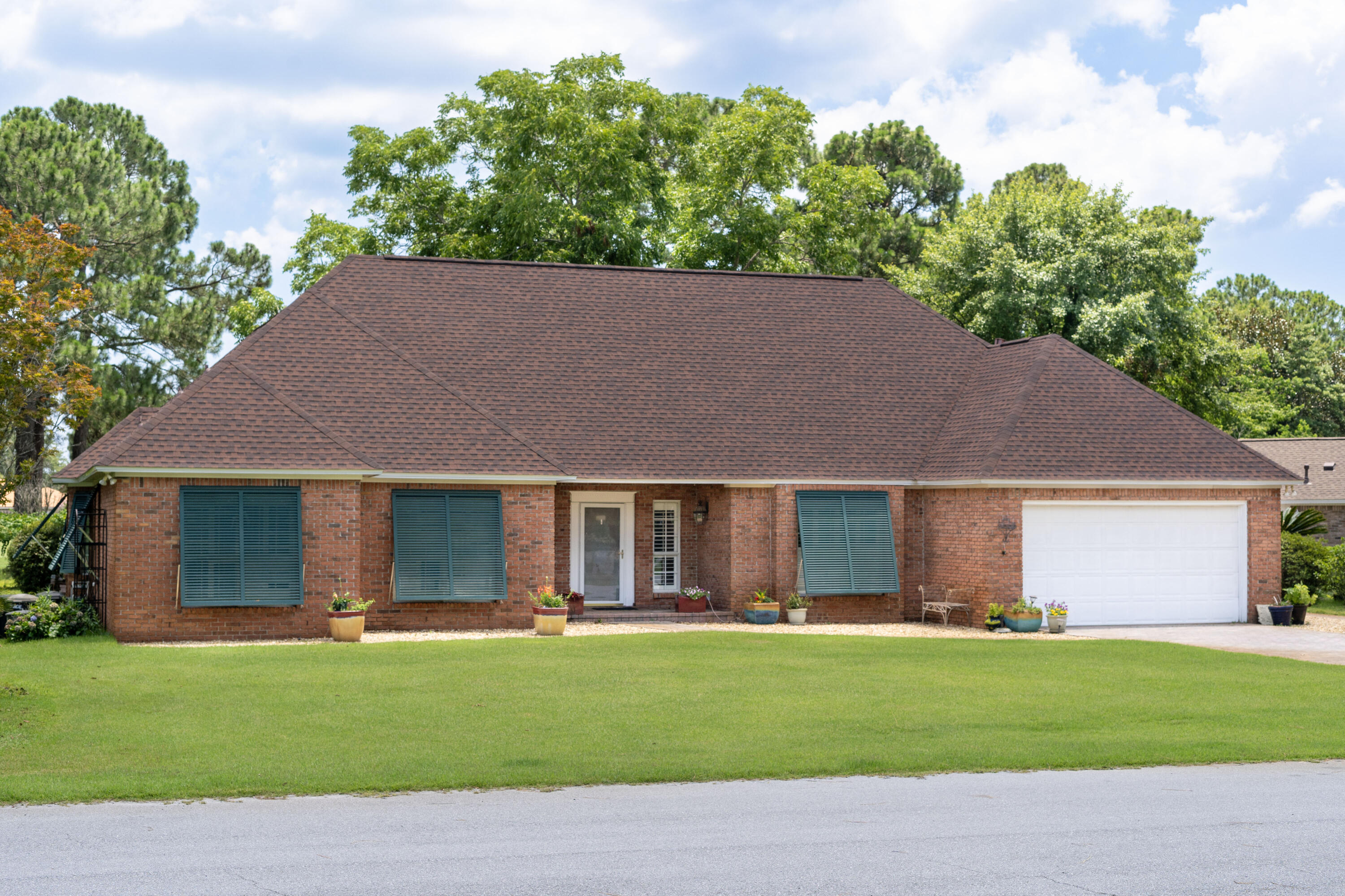 front view of a house with a garden