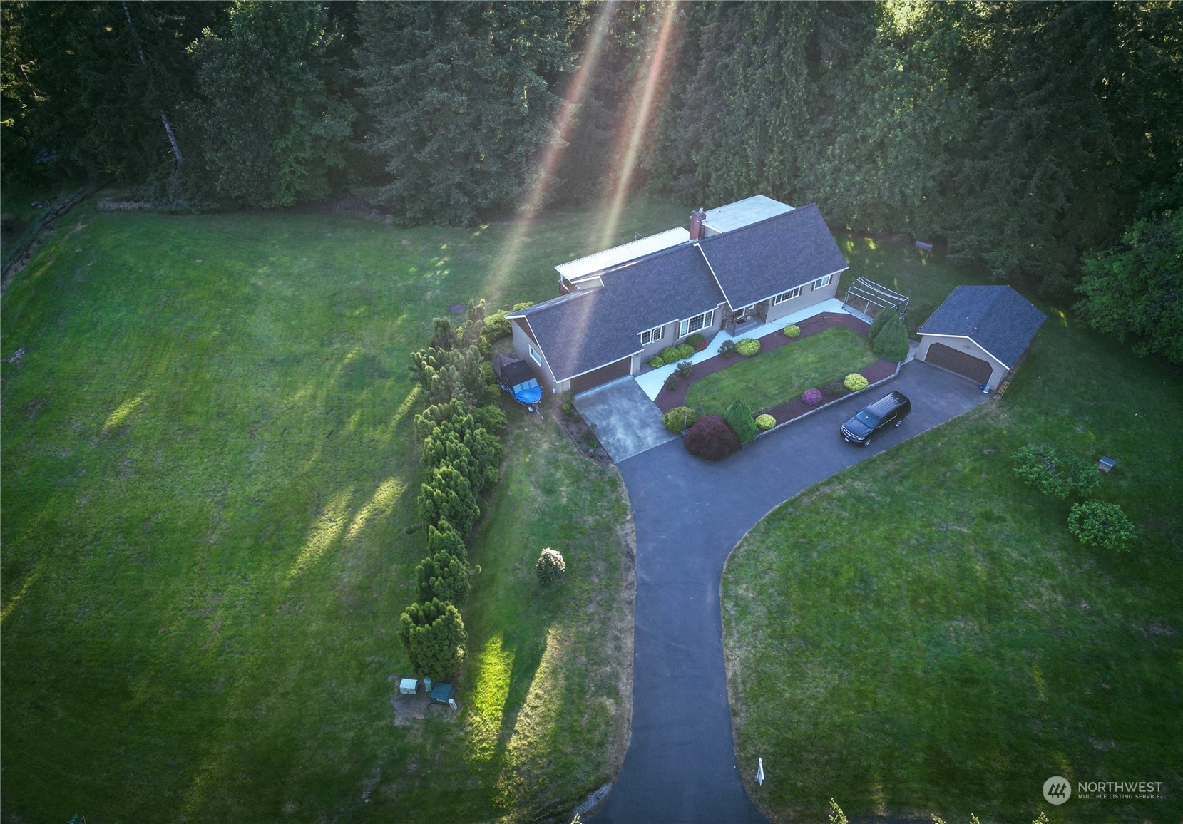 an aerial view of a house with garden