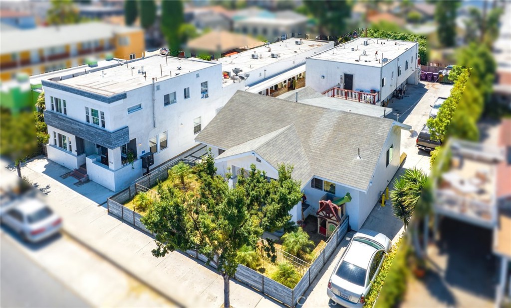 an aerial view of residential houses with outdoor space