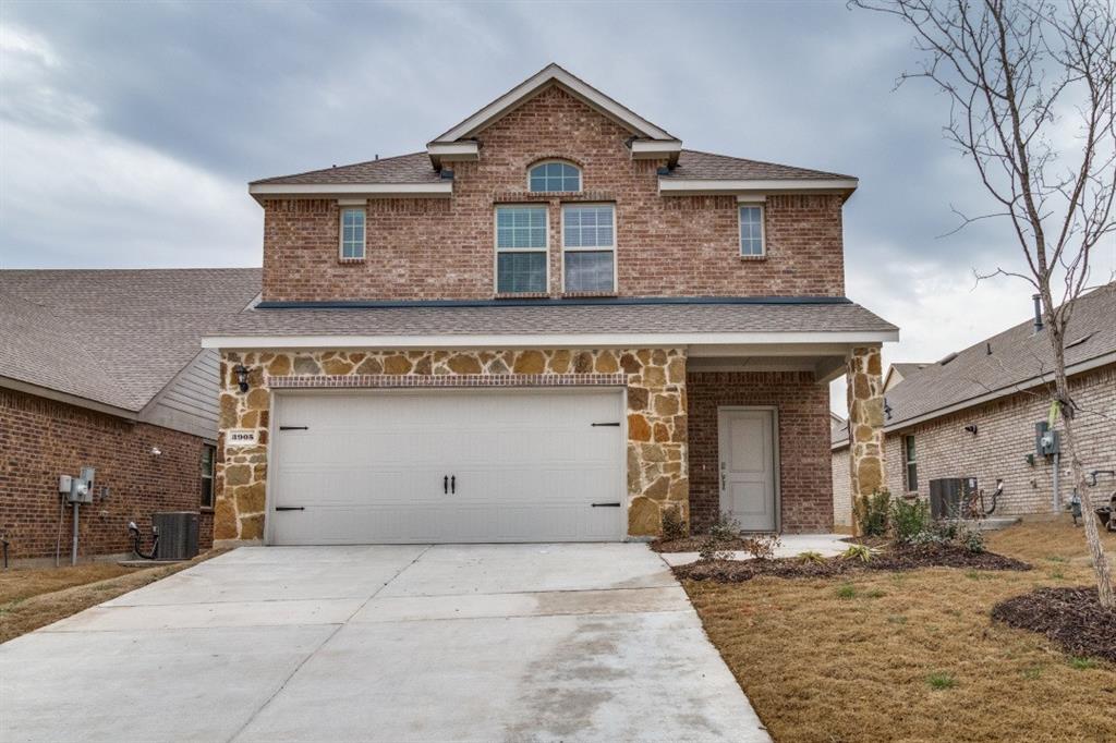 a front view of a house with garage