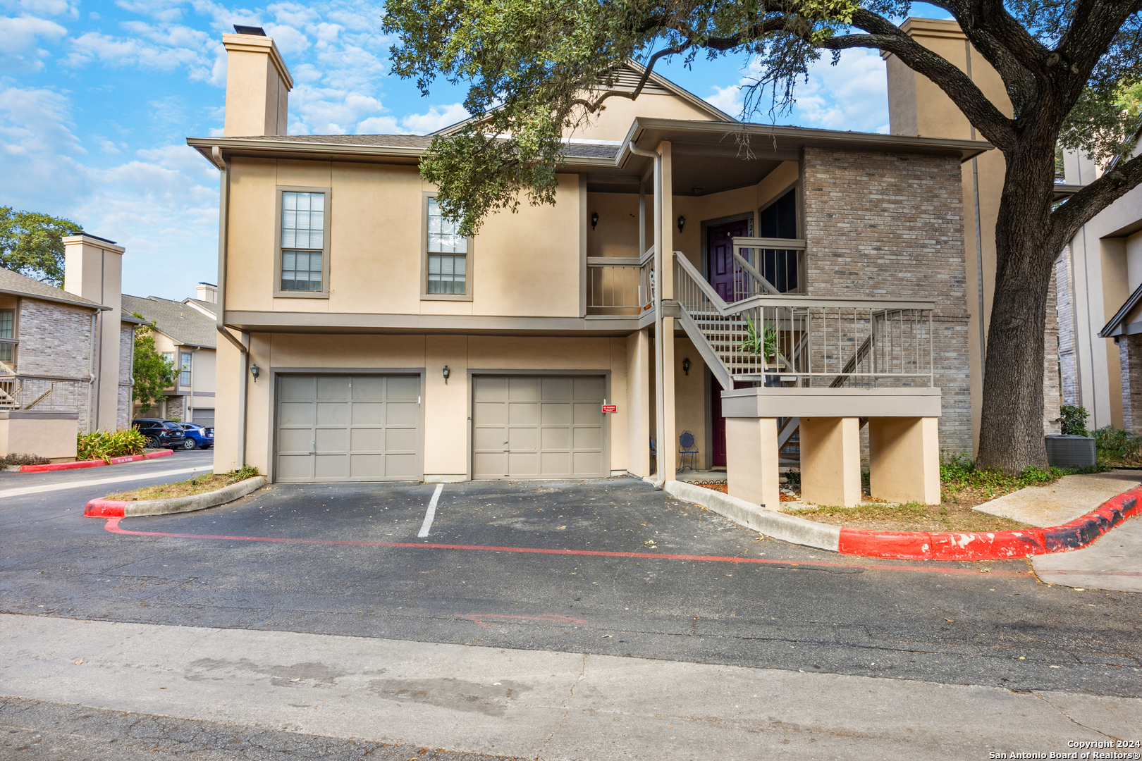 a front view of a house with garage