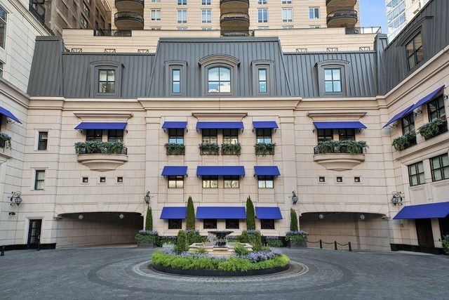 a front view of a building with glass windows