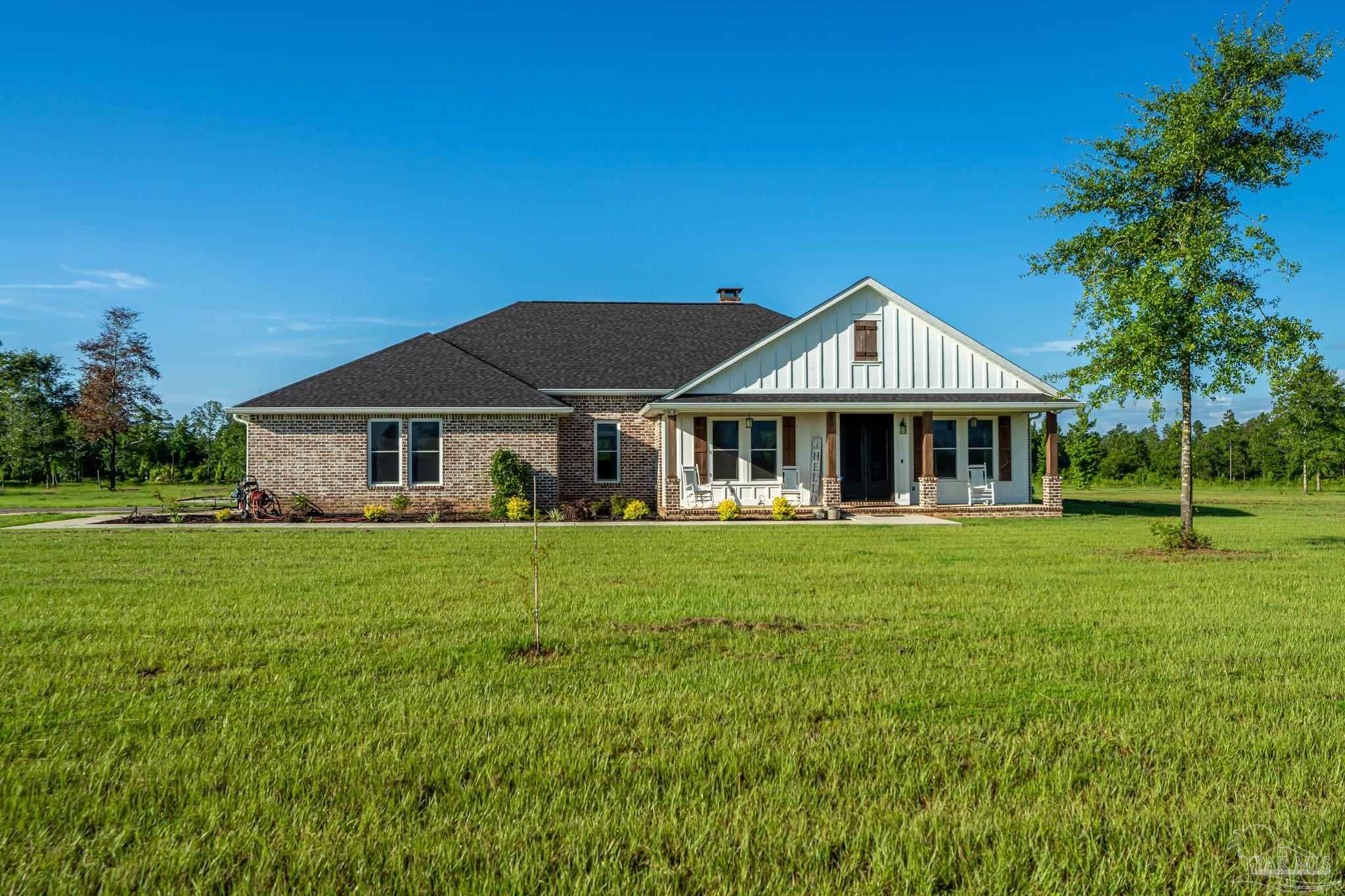 a front of a house with a garden