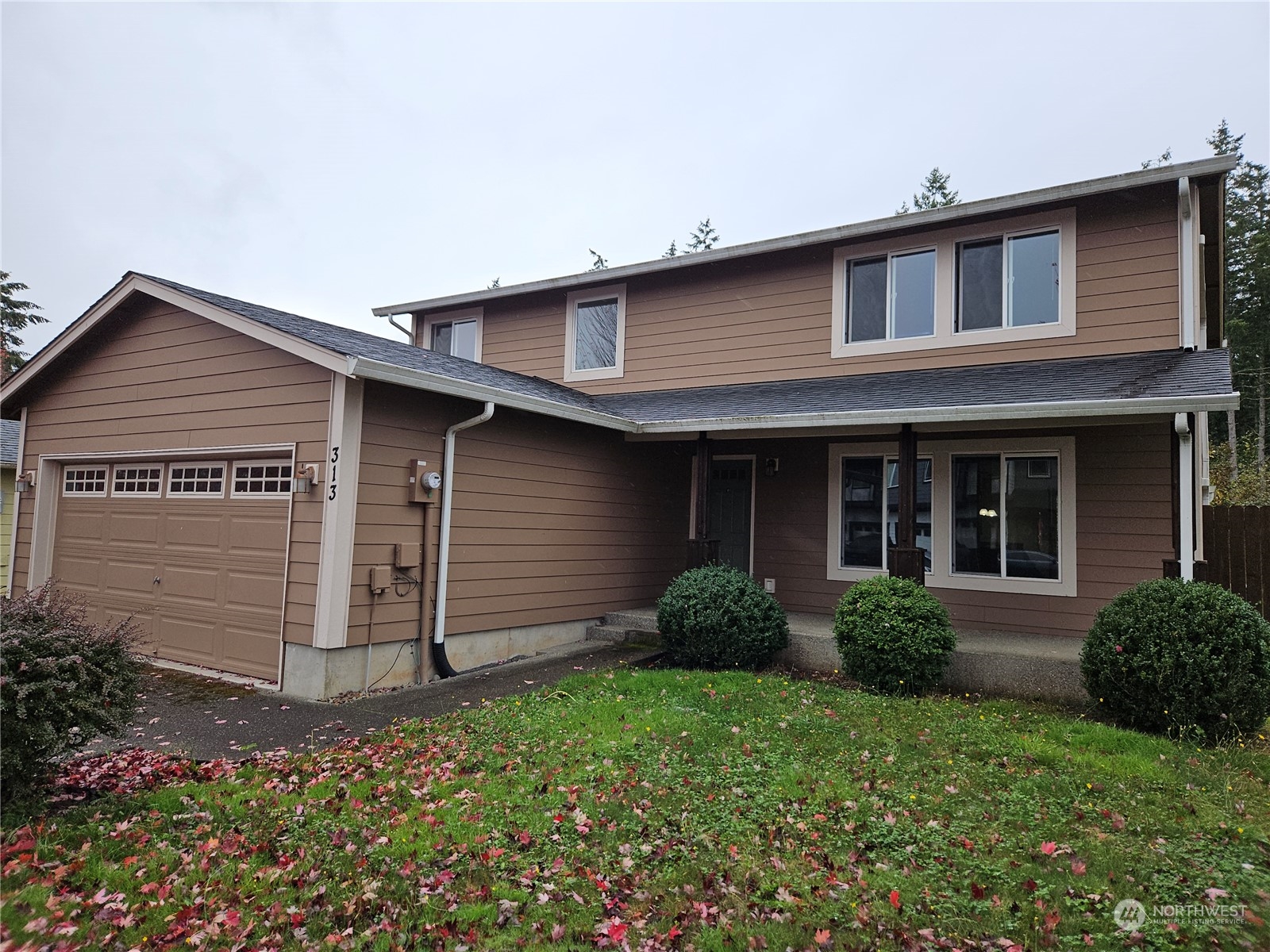 front view of a house with a yard