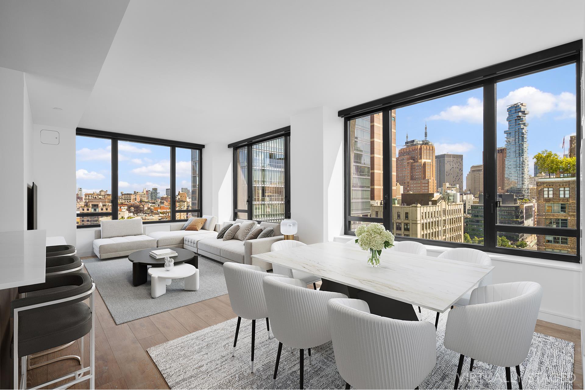 a living room with furniture large windows and view