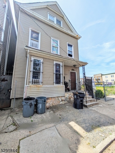 a front view of a house with barbeque oven