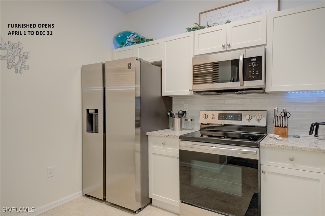 a kitchen with cabinets stainless steel appliances and a counter space