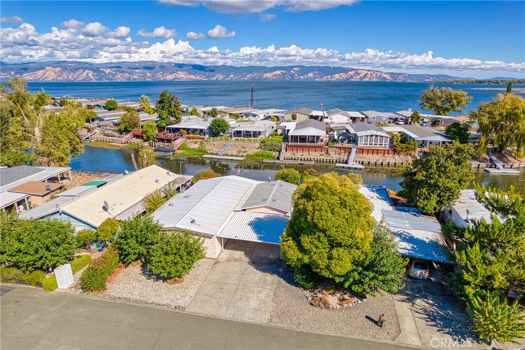 an aerial view of a house with a ocean view