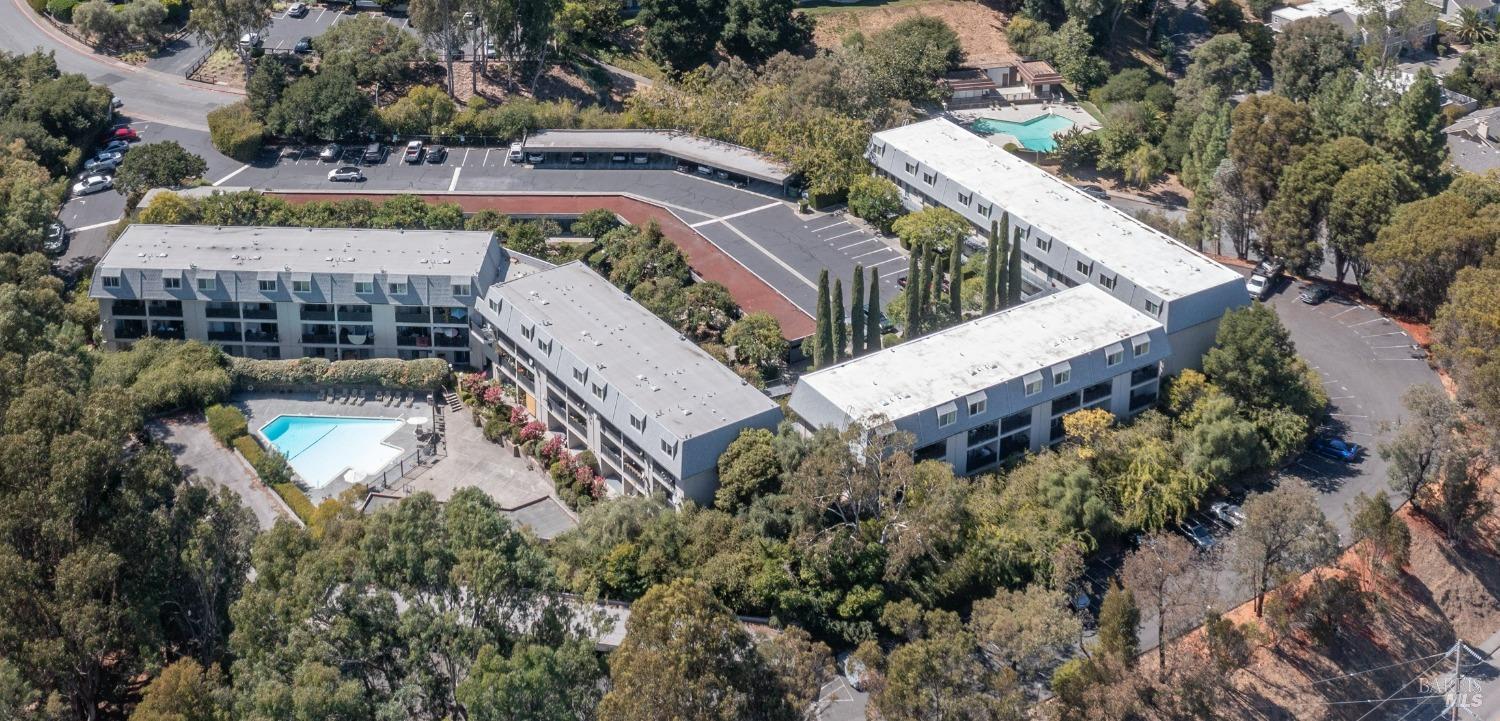 an aerial view of a house with a yard