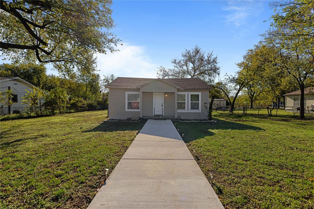 front view of a house with a yard