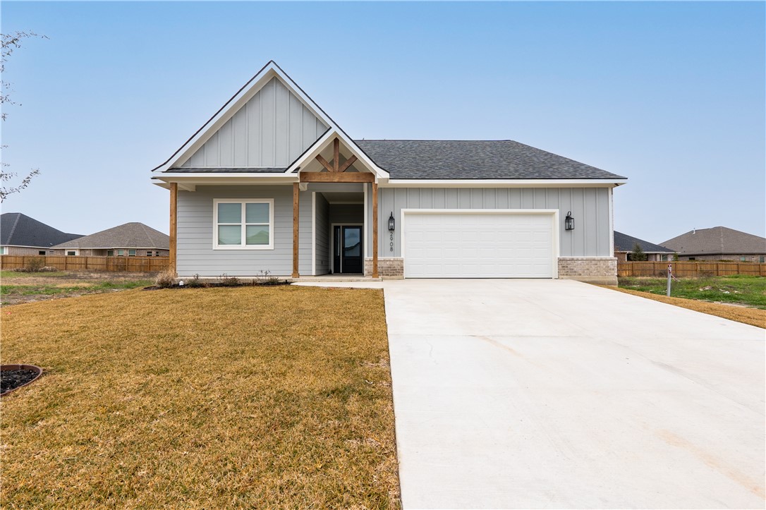 View of front of property with a garage and a fron