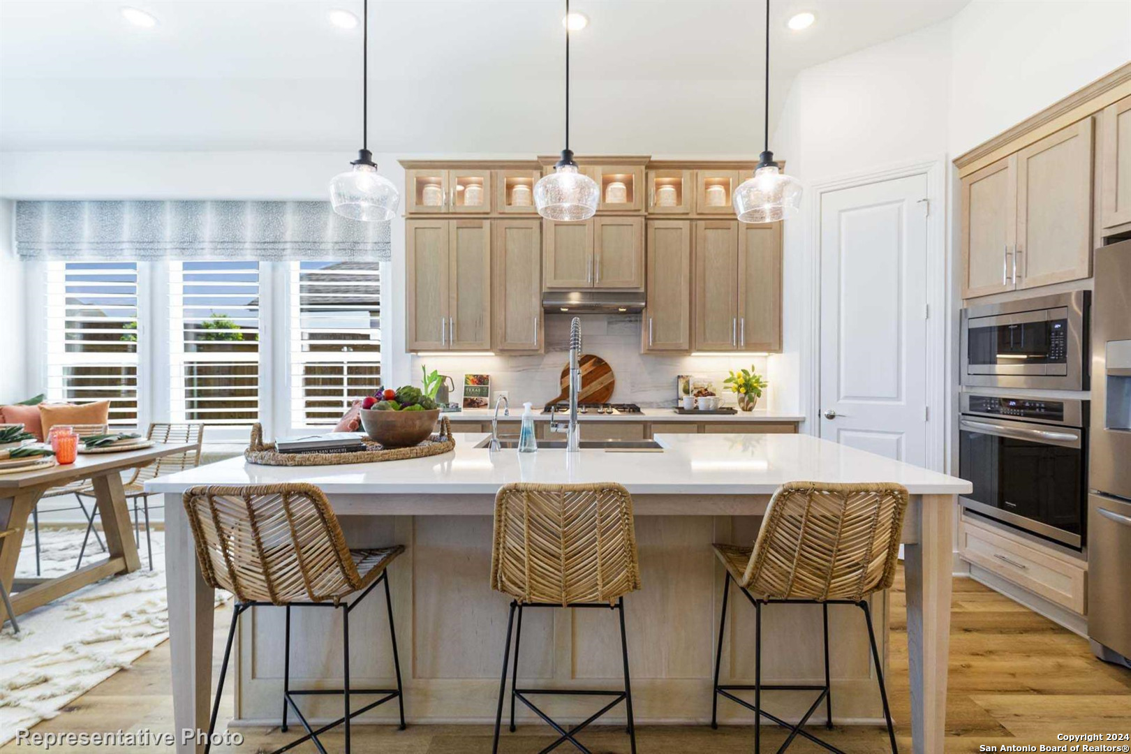 a kitchen with stainless steel appliances granite countertop a stove a sink and a refrigerator