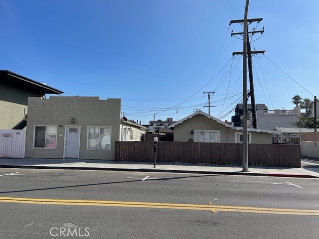 a front view of a house with a street