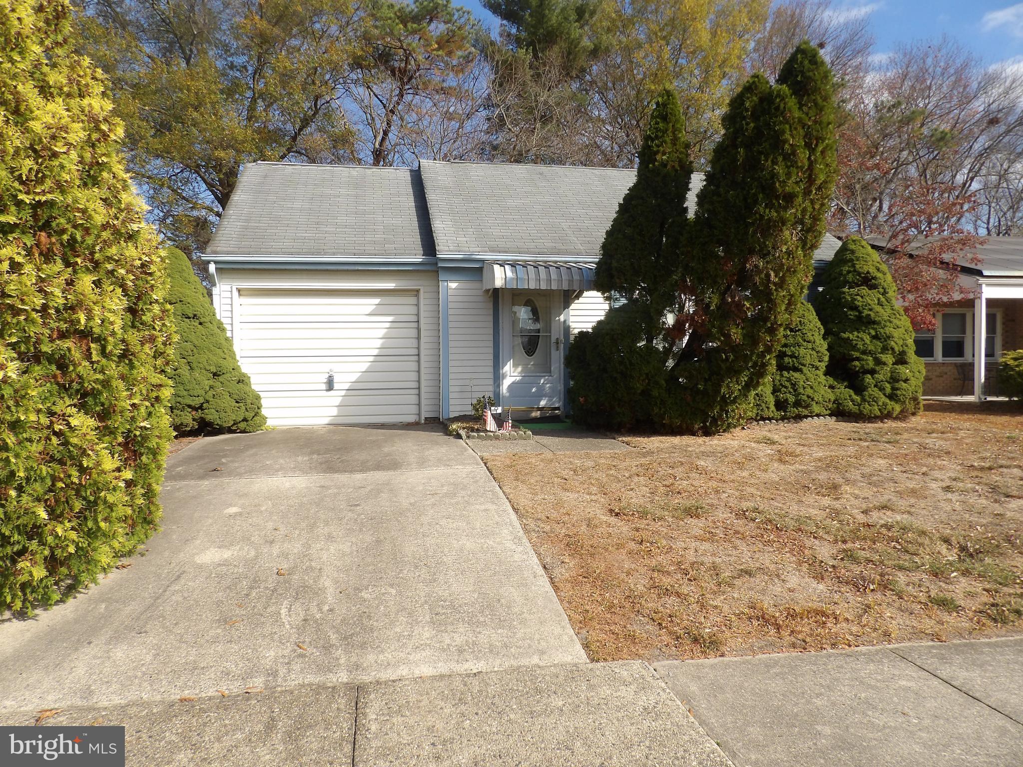 a view of garage and yard